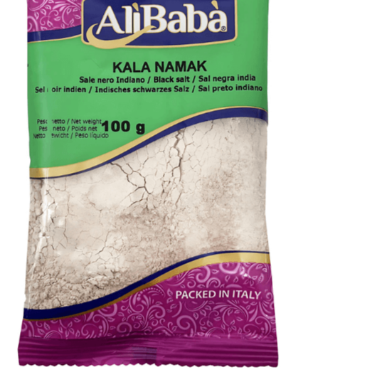 Pack of AliBaba Kala Namak black salt with purple and green design on a white background